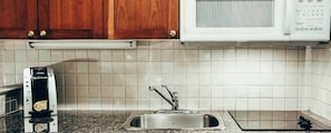 Prepare meals in the kitchenette.