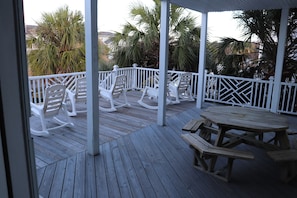 Picnic table under covered deck.  Very large deck area.