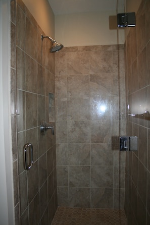 1st floor master bathroom with luxurious spa shower