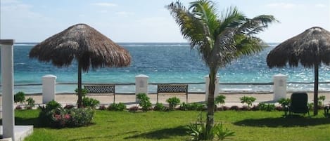 View of ocean and patio/pool area