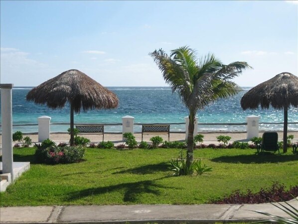 View of ocean and patio/pool area