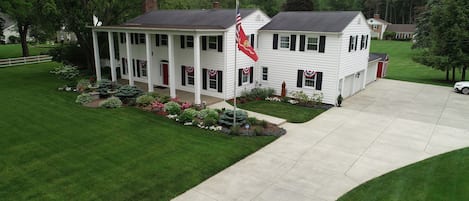 Main house showing the guest house (in the west wing behind the flag pole).