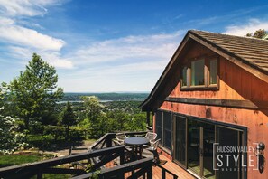 The south deck features seating and a Weber grill to enjoy the view outdoors.