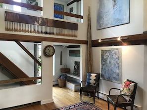 Downstairs Living Room, view to front door and upstairs