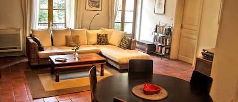 Living room - open plan, doors and windows onto private garden