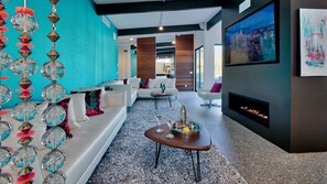 Modern Mid-Century design with sparkle and comfort.  70" HD TV  and fireplace