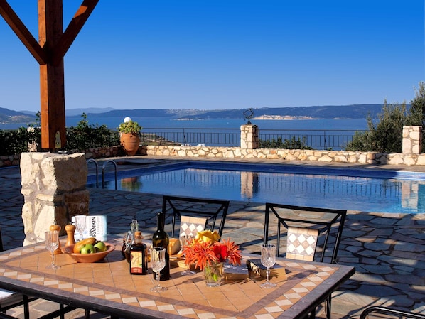 Outdoor dining overlooking Souda Bay & Akrotiri beyond