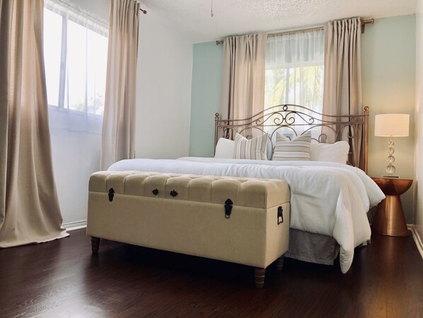 Welcome to paradise! King size bed with premium bedding in the master bedroo