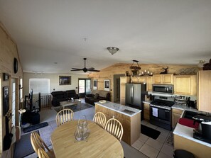 Great room. Kitchen, Dining, Living room 1, hammock, binoculars, 4K TV & Xbox