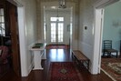 Front Hall viewed from entry, Den and LR to left, Dining Room & Kitchen to right