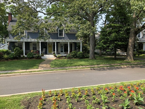 Watch the summer unfold from the spacious porch.