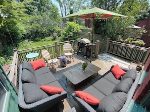 Deck overlooking garden - Gas grill makes for many an easy summer meal outdoors