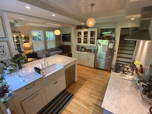 Open to the family room and television area, the kitchen is a favorite hangout