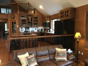 Living room looking into open kitchen
