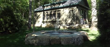 Bear's cottage nestled in a quiet park-like setting on Mirror Lake drive.