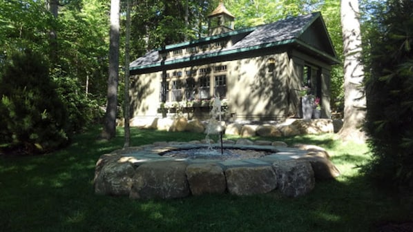 Bear's cottage nestled in a quiet park-like setting on Mirror Lake drive.