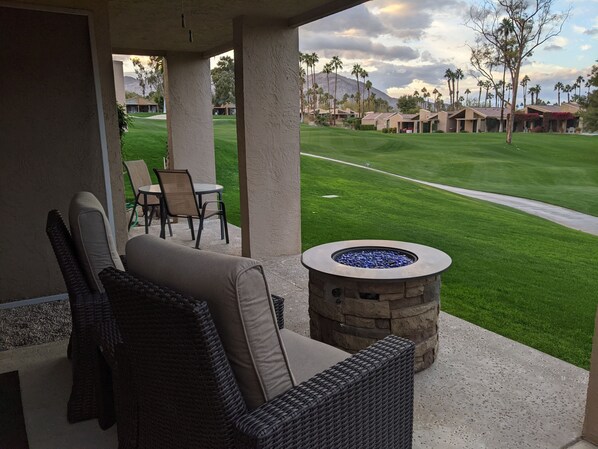 Pair of recliners and a fire pit to enjoy the outside space.