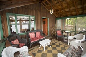 Palmer House screened porch steps from Fourth Lake.