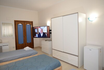 TRIPLE ROOM WITH BALCONY AND SAMSUNG TV LATEST GENERATION