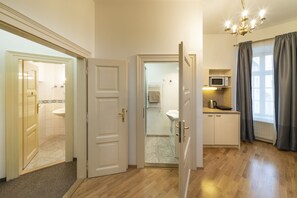 Separate toilet, bathroom with shower and small kitchen