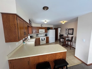 Kitchen with cookware, utensils & essential appliances