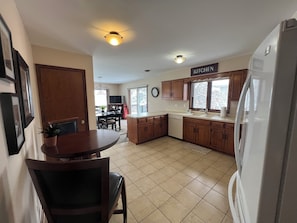 Kitchen with cookware, utensils & essential appliances