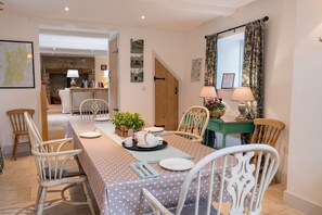 Ground floor: Well appointed dining room with table seating four guests