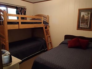 Bedroom #2 with twin bunk beds and double bed.