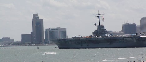 Beach view of USS Lexington and downtown Corpus  