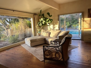 Kitchen seating area to pool (by Mitchell + Gold)