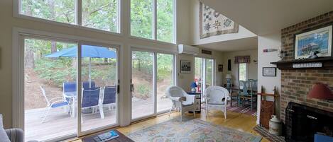 Living room and dining room have sliders to the deck