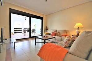 View of the bright and spacious lounge area with access to the terrace