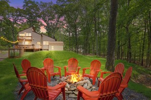 Cozy fire pit tucked at the back, perfect for s'mores, stories, and stargazing.