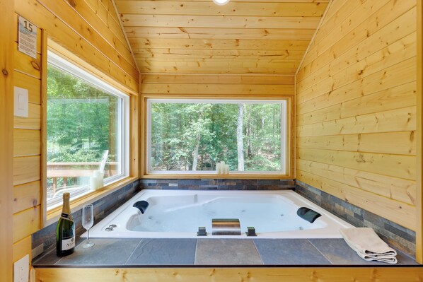 Soak in master suite's jetted jacuzzi tub with panoramic views & heated floor.
