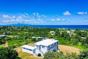 Hillside views of the ocean and main island.