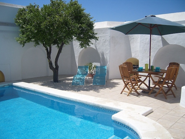 Walled patio with private pool