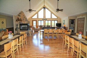 Open dining room and living room with gorgeous hardwood floors.  