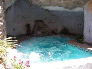 Jacuzzi pool set into a cave
