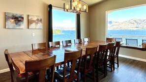 Very large, custom built dining room table with beautiful views of Lake Chelan