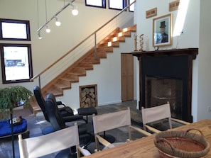 Living room fireplace and stairs. 