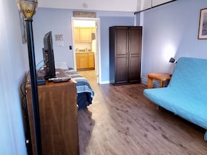 Kitchen, private bath, and large parking space included in this 1 Bedroom.