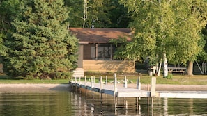 Lakeside cabin just steps away from the water and dock.