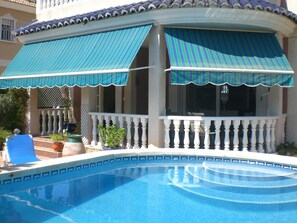 Veranda with blinds out to keep out of the sun!