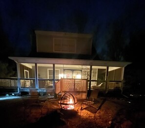 Fire pit with seating under the stars.