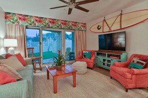 Coastal Motif Living Room with Sleeper Sofa, (2) Chairs & Large Flat Screen TV