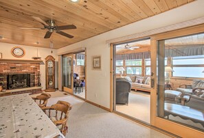 Sliding glass doors separate the common room from the sun room.