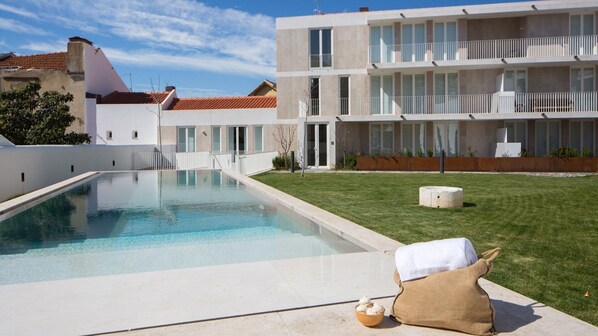 Take a refreshing dip in the swimming pool, offering a tranquil escape from the hustle and bustle of the city. #pool #airbnb #pt #lisbon