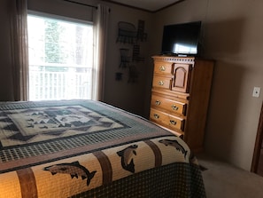 Master bedroom has a king size bed, with lake view and a big screen cable TV. 