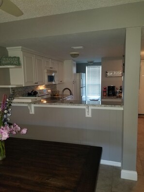 The large table seats 8 comfortably. The kitchen is open for your needs.