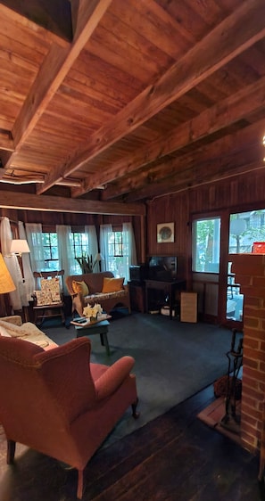 Cozy living room with TV, stereo, fireplace & access to covered front porch!